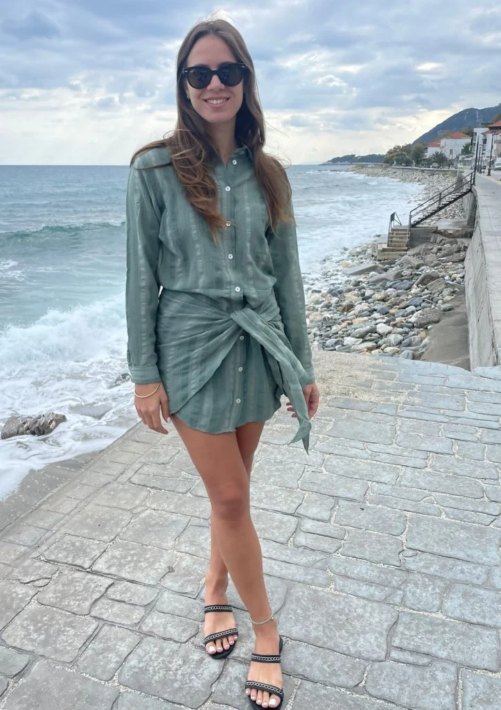 Woman standing by the sea, portrait shared on a memorial page